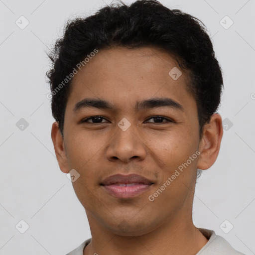 Joyful latino young-adult male with short  brown hair and brown eyes