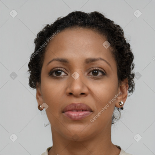 Joyful latino young-adult female with short  brown hair and brown eyes