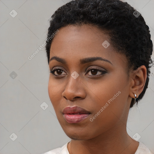 Neutral black young-adult female with short  black hair and brown eyes