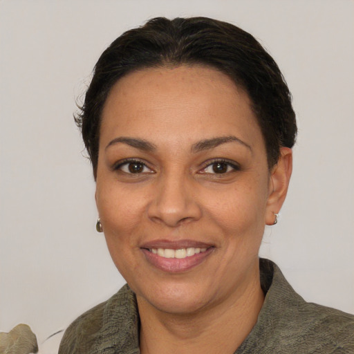 Joyful white adult female with short  brown hair and brown eyes
