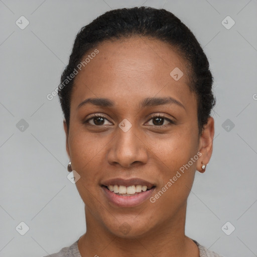 Joyful black young-adult female with short  black hair and brown eyes