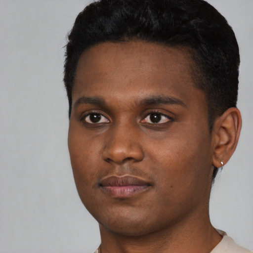 Neutral black young-adult male with short  black hair and brown eyes