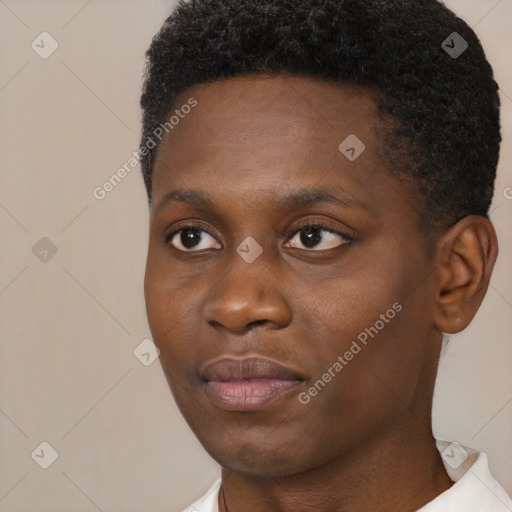 Joyful black young-adult male with short  brown hair and brown eyes