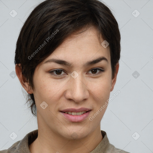 Joyful asian young-adult female with short  brown hair and brown eyes