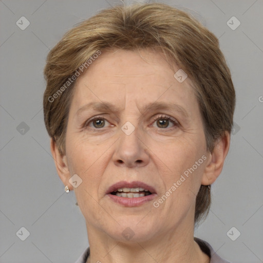 Joyful white adult female with short  brown hair and grey eyes