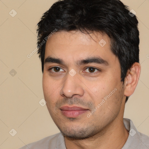 Joyful white young-adult male with short  black hair and brown eyes