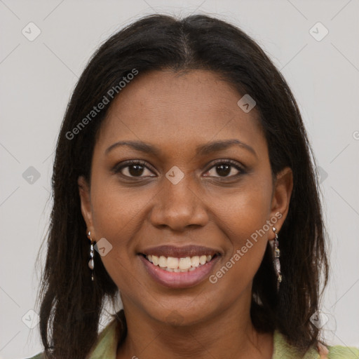 Joyful black young-adult female with long  brown hair and brown eyes