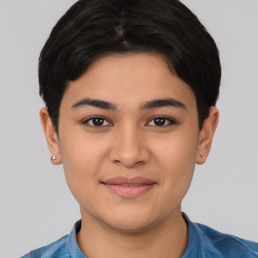Joyful latino young-adult female with short  black hair and brown eyes