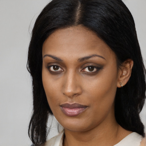 Neutral black young-adult female with medium  black hair and brown eyes
