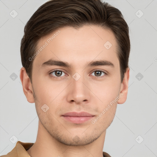 Joyful white young-adult male with short  brown hair and grey eyes