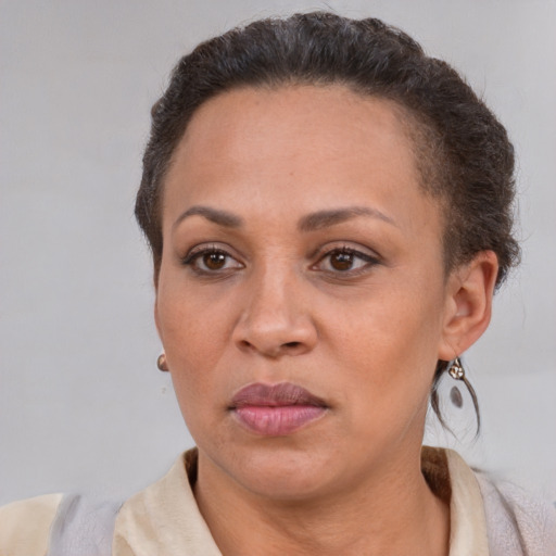 Neutral latino adult female with short  brown hair and brown eyes