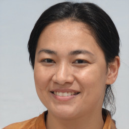 Joyful white adult female with medium  brown hair and brown eyes