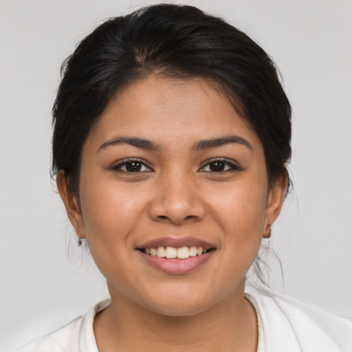 Joyful asian young-adult female with medium  brown hair and brown eyes