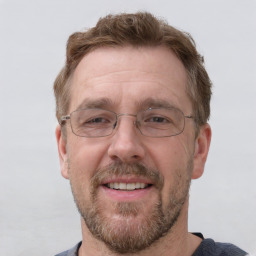 Joyful white adult male with short  brown hair and grey eyes