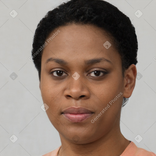 Joyful black young-adult female with short  black hair and brown eyes