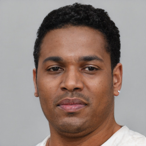 Neutral black young-adult male with short  black hair and brown eyes