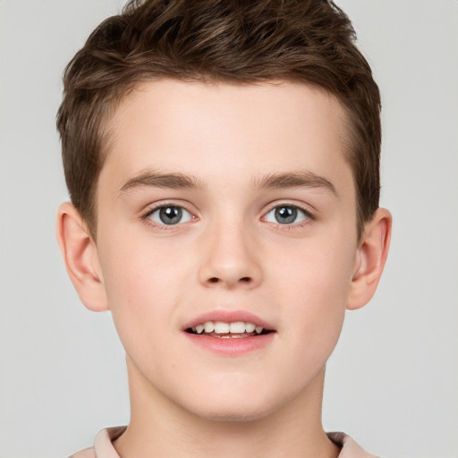 Joyful white child male with short  brown hair and brown eyes