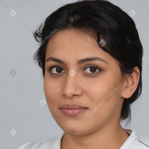 Joyful latino young-adult female with medium  black hair and brown eyes