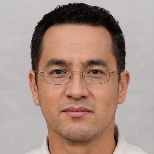 Neutral white adult male with short  black hair and brown eyes