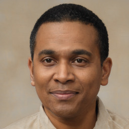 Joyful latino adult male with short  black hair and brown eyes
