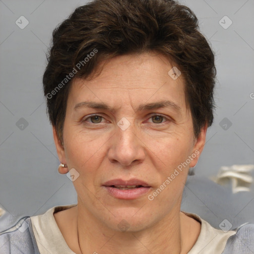 Joyful white adult female with short  brown hair and grey eyes