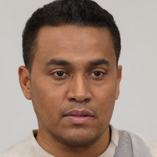 Neutral latino young-adult male with short  black hair and brown eyes