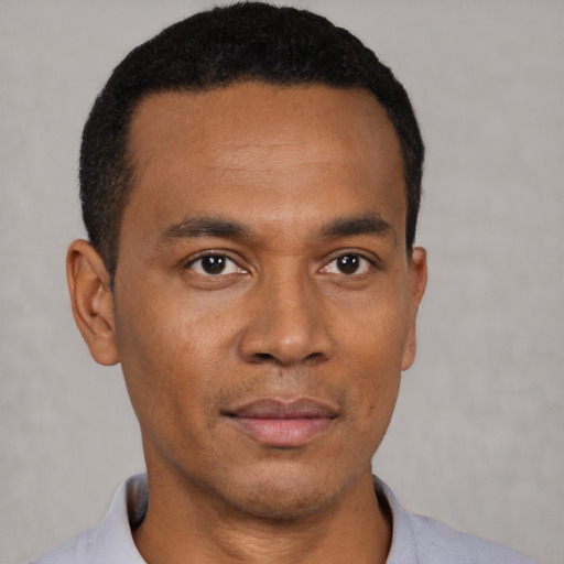 Neutral black young-adult male with short  black hair and brown eyes