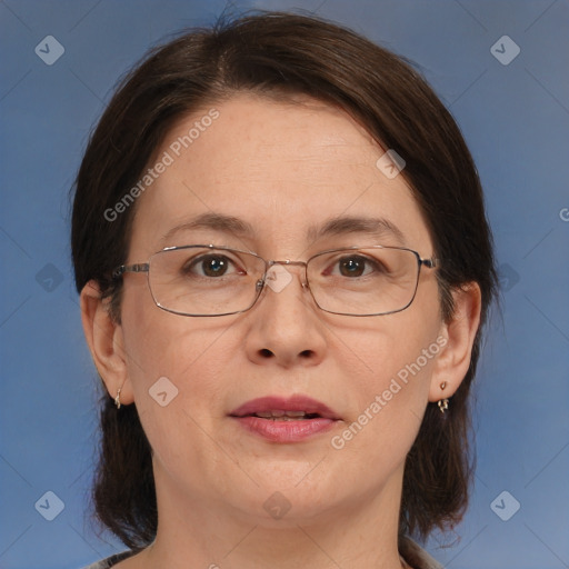 Joyful white adult female with medium  brown hair and brown eyes