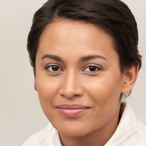 Joyful white young-adult female with short  brown hair and brown eyes