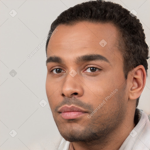 Neutral white young-adult male with short  black hair and brown eyes