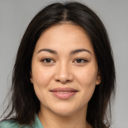 Joyful asian young-adult female with medium  brown hair and brown eyes