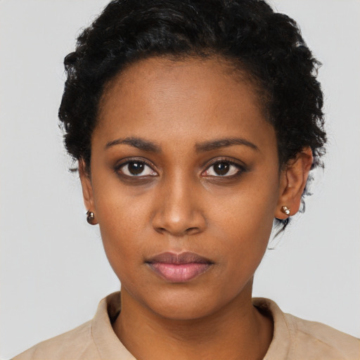 Neutral black young-adult female with short  black hair and brown eyes