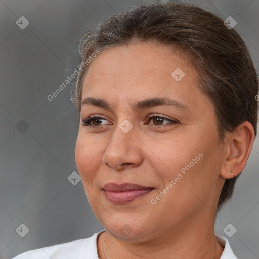 Joyful white adult female with short  brown hair and brown eyes