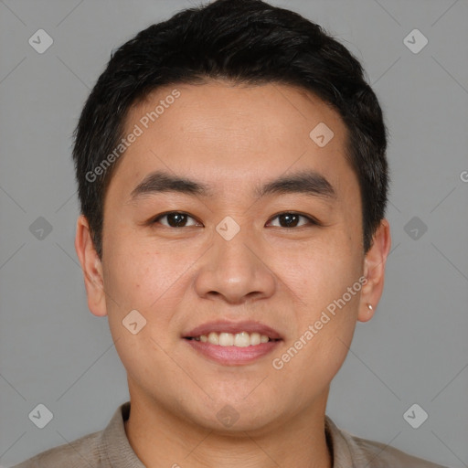 Joyful asian young-adult male with short  brown hair and brown eyes