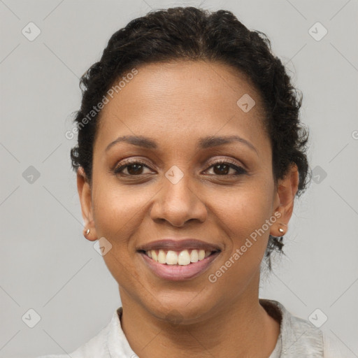 Joyful latino young-adult female with short  brown hair and brown eyes