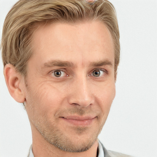 Joyful white adult male with short  brown hair and grey eyes