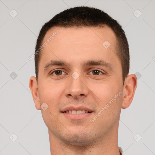 Joyful white young-adult male with short  brown hair and brown eyes