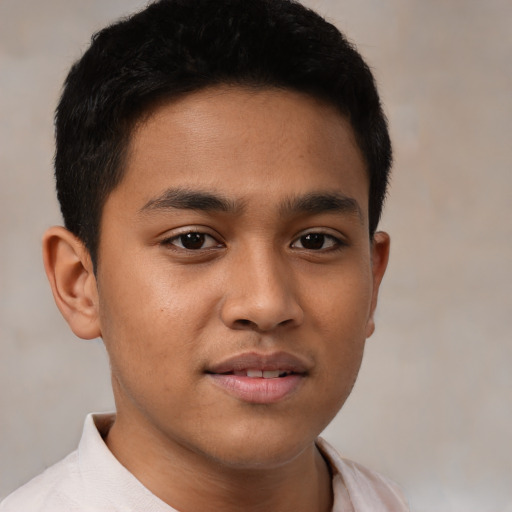 Joyful latino young-adult male with short  brown hair and brown eyes