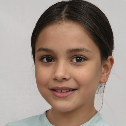 Joyful white child female with medium  brown hair and brown eyes