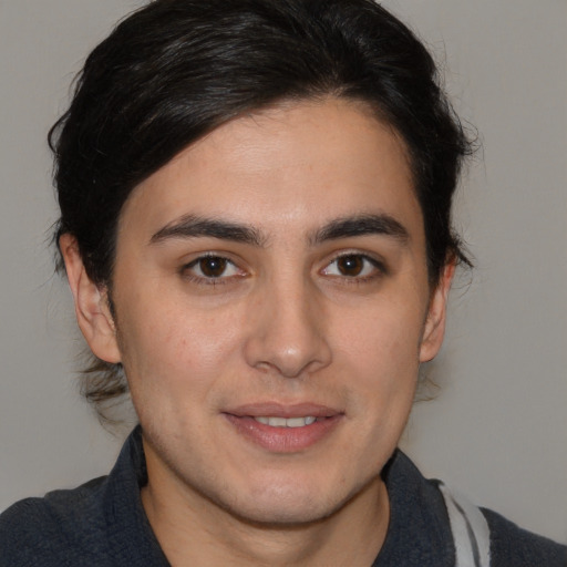 Joyful white young-adult male with medium  brown hair and brown eyes
