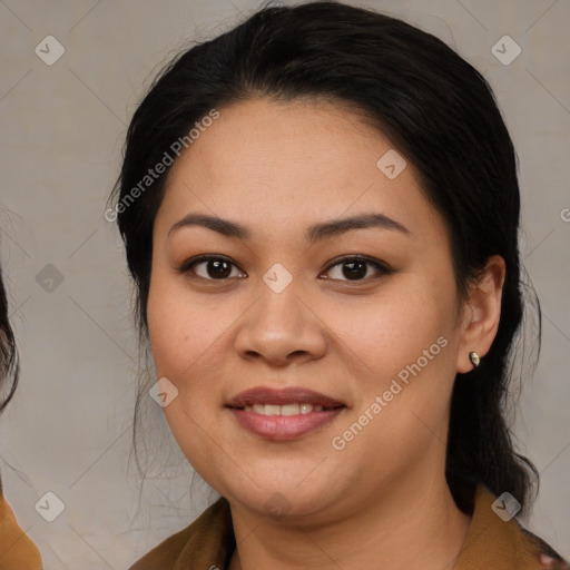 Joyful latino young-adult female with medium  brown hair and brown eyes