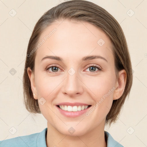 Joyful white young-adult female with medium  brown hair and blue eyes