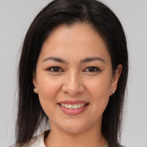 Joyful asian young-adult female with medium  brown hair and brown eyes