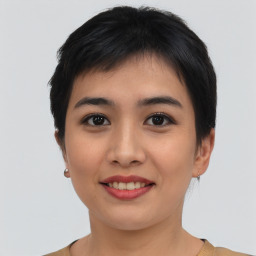 Joyful asian young-adult female with short  black hair and brown eyes