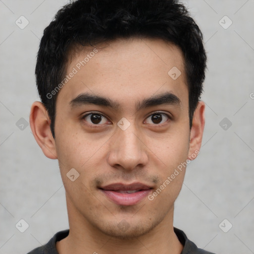 Joyful latino young-adult male with short  black hair and brown eyes