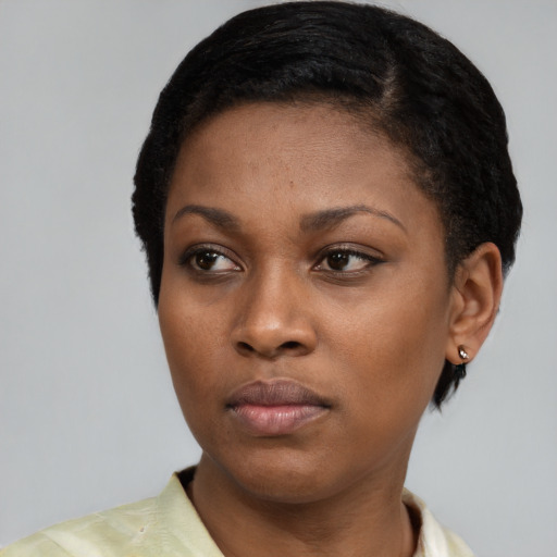 Neutral black young-adult female with short  black hair and brown eyes