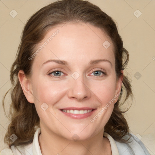 Joyful white young-adult female with medium  brown hair and blue eyes