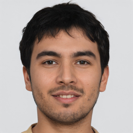 Joyful asian young-adult male with short  brown hair and brown eyes