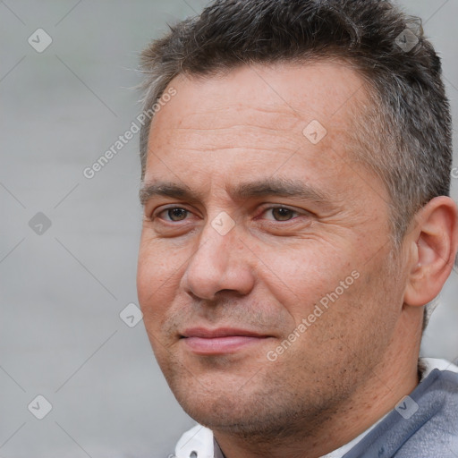 Joyful white adult male with short  brown hair and brown eyes