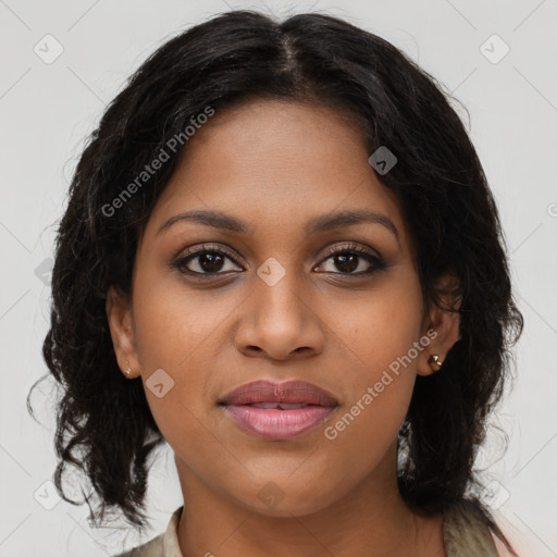 Joyful black young-adult female with long  brown hair and brown eyes